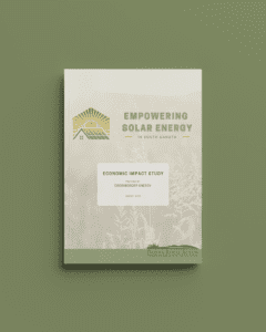 Mockup image of the Empowering Solar in South Dakota Economic Report with a green background