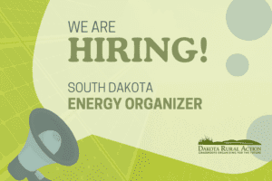 Graphic of megaphone and speech bubble with the text We are hiring! South Dakota Energy Organizer in tones of bright green.